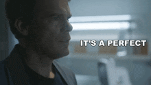 a man in a suit says " it 's a perfect " in a dark room