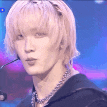 a close up of a person 's face with a microphone on