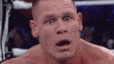 a close up of a man with his mouth open .
