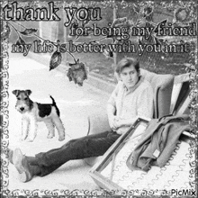 a black and white photo of a man sitting on a couch next to a dog with the words thank you for being my friend