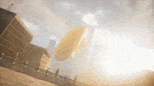 a large yellow object is flying through the air
