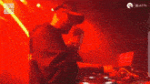 a man is playing music on a stage with the words sound waves on the bottom