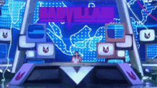 a woman sitting in front of a screen that says badvillain