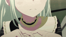 a close up of a person 's face with a necklace around their neck