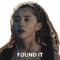 a woman with dreadlocks and a necklace has found it written on her face