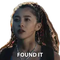 a woman with dreadlocks and a necklace has found it written on her face