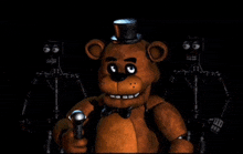 a brown teddy bear with a top hat is holding a microphone in a dark room