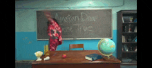 a chalkboard in a classroom with the words american dream are true written on it