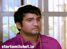 a man in a purple shirt has the website starttamilchat.in on the bottom right