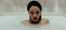 a woman with black lipstick is sitting in a bathtub .