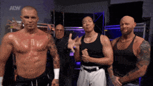 a group of men standing next to each other with the aew logo on the bottom right