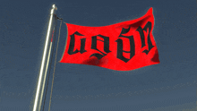 a red flag with black letters that says ' go on '