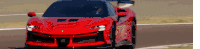 a red sports car is driving down a track