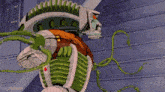 a cartoon robot with a green hose coming out of it 's chest .