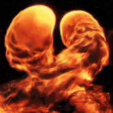 a painting of a skull made of flames