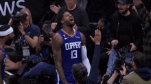 a basketball player with the number 13 on his shirt
