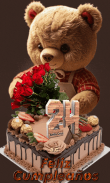 a teddy bear holding a bouquet of red roses next to a birthday cake