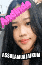 a girl with the name andinda written on her face