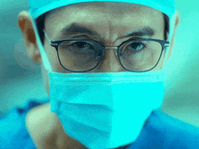 a close up of a man wearing glasses and a mask
