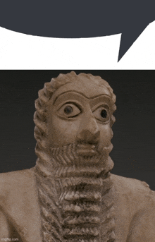 a statue of a man with a beard and big eyes