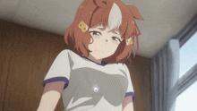 a girl with brown hair and white ears is wearing a white shirt with a purple border