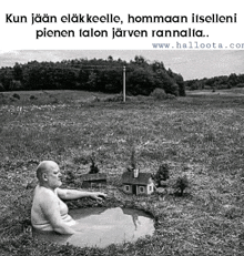 a black and white photo of a man in a puddle of water with a small house in the background