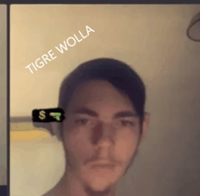 a man with a sticker on his head that says tigre wolla on it