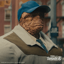 a man wearing a baseball cap and a jacket with the fantastic 4 first steps written on the bottom