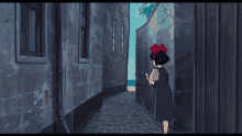a little girl with a red bow on her head is standing in a narrow alleyway