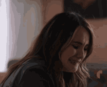 a woman is crying with a red t on the bottom right