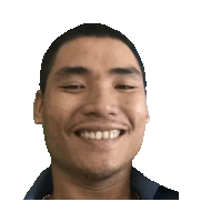 a man with a shaved head and a beard is smiling