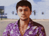 a man wearing a purple floral shirt and glasses is standing on a beach .