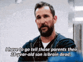 a man with a beard says i have to go tell those parents their 18 year old son is brain dead .