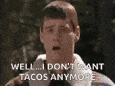 a man is making a funny face and saying `` well ... i don t want tacos anymore '' .
