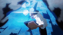 a man in a white shirt and blue hat is standing in the water with a light coming out of his hand
