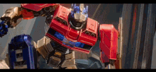 a robot with a red and blue body is flying through the air
