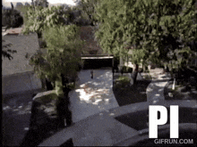 a gif from gifrun.com shows a person walking on a sidewalk