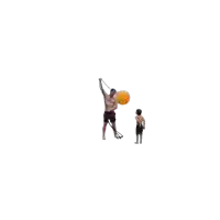 a shirtless man is holding an orange ball while a boy watches