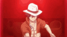 a man in a red shirt and white hat stands in a red room