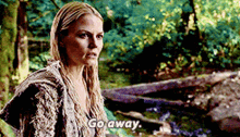 a woman in a sweater says go away