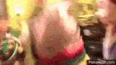 a blurry picture of a person standing in a room with a bowl of food .