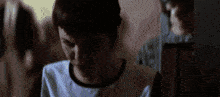 a close up of a person 's face with a blurry background .