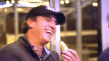 a man wearing a black hat with the word la on it