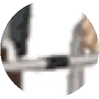 a blurry picture of a person sitting at a desk with a laptop computer .