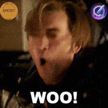 a close up of a man 's face with the word woo written on it