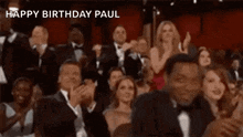 a crowd of people applauding with the words happy birthday paul