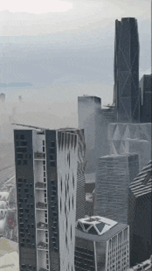 a cityscape with a lot of tall buildings and smoke coming out of them