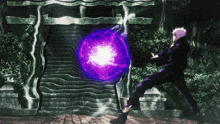 a person is standing in front of a large purple ball