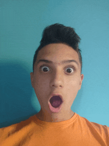a young boy making a surprised face with his mouth open