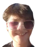 a young boy wearing sunglasses with purple lenses